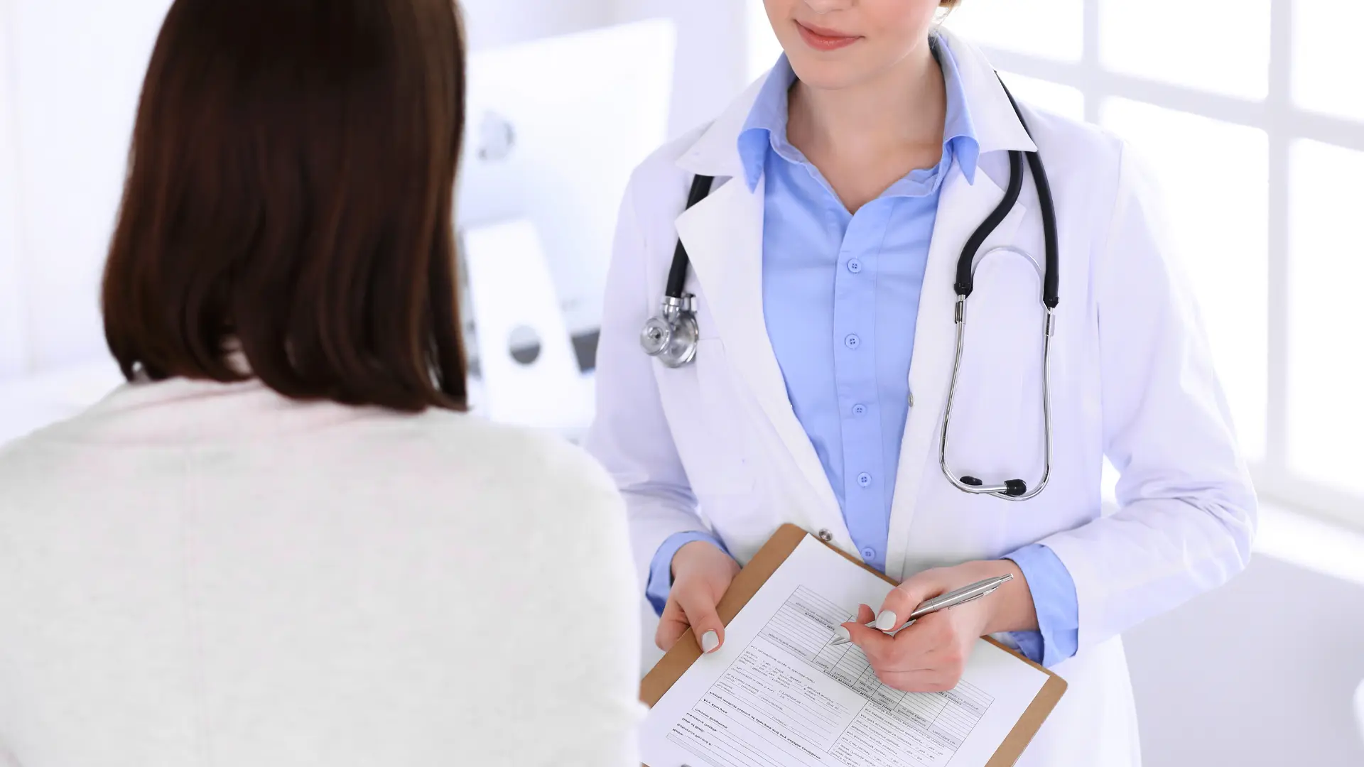 Pharmacist consulting with a patient